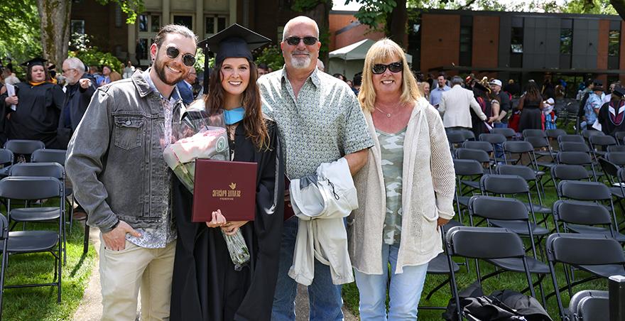 A family poses for a picture at SPU